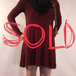 Long sleeved, loose, maroon dress
